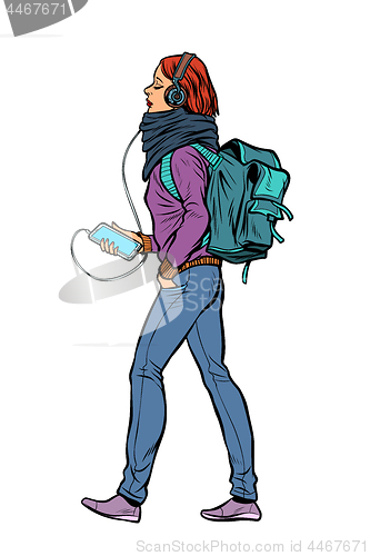 Image of young woman with smartphone listening to music in headphones
