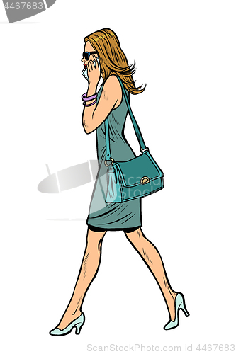 Image of woman in dress, talking on the phone