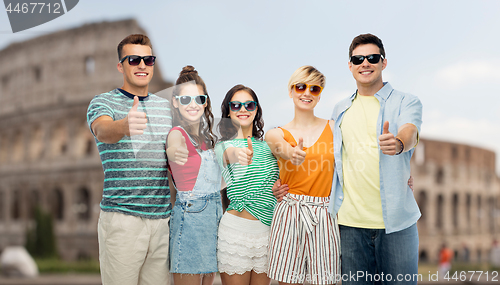 Image of friends showing thumbs up over coliseum background