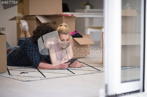 Image of Young couple moving in a new flat