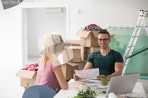 Image of Young couple moving in a new home