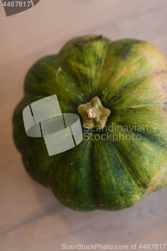 Image of pumpkin on a wooden table