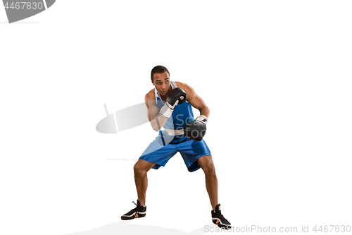 Image of Sporty man during boxing exercise. Photo of boxer on white background