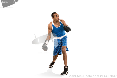 Image of Sporty man during boxing exercise. Photo of boxer on white background