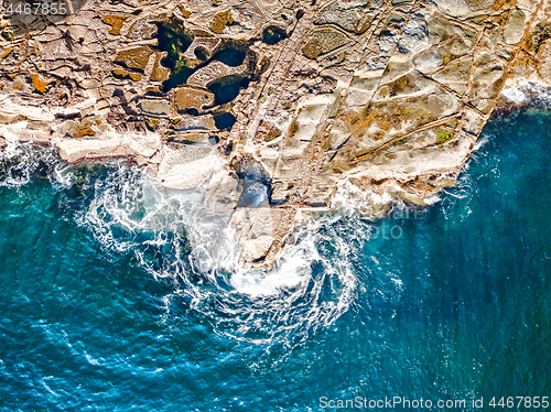 Image of Rocks, rockpools and ocean swirls