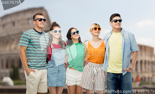 Image of friends in sunglasses over coliseum background