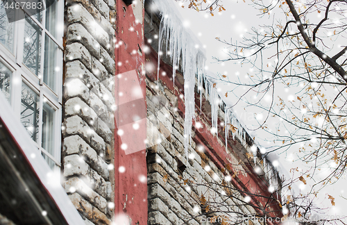 Image of icicles on building or living house facade