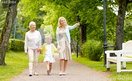 Image of happy mother, daughter and grandmother at park