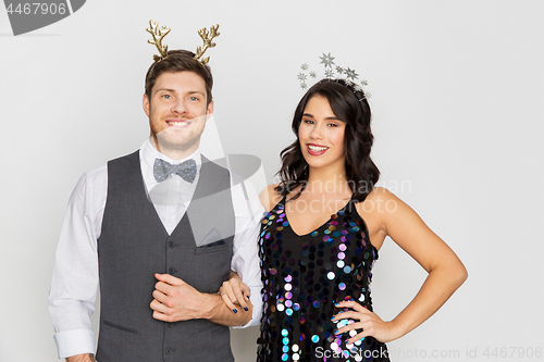 Image of couple with christmas or new year party props