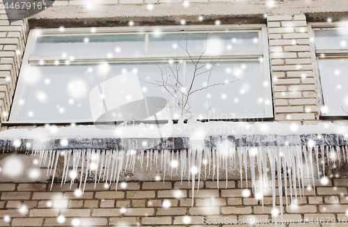 Image of icicles on building or living house facade