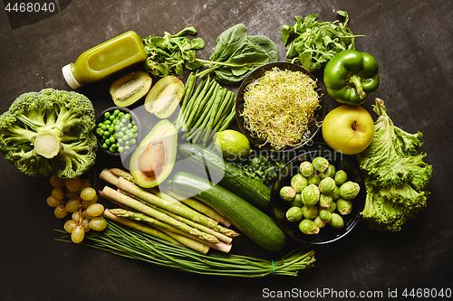 Image of Green healthy food composition with avocado, broccoli, apple, smoothie...