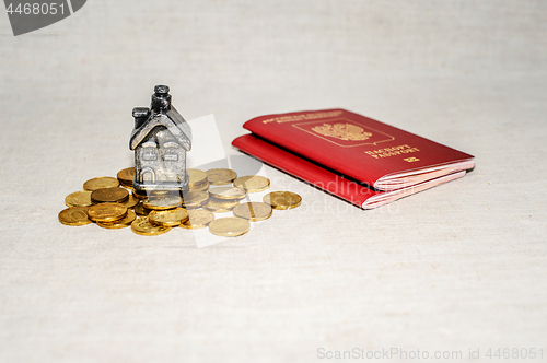 Image of Passport, money and home - the concept of buying a property