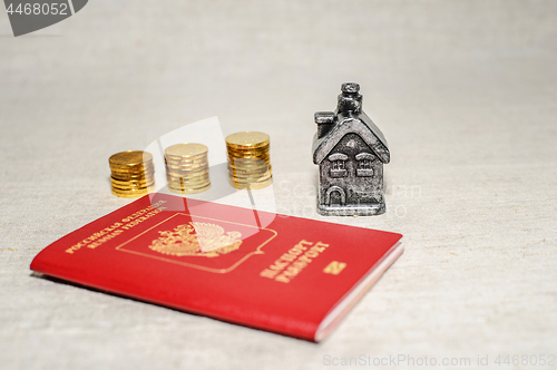 Image of Passport, money and home - the concept of buying a property