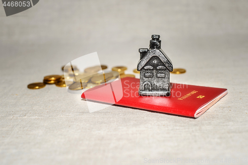 Image of Passport, money and home - the concept of buying a property