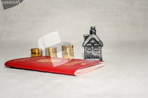 Image of Passport, money and home - the concept of buying a property