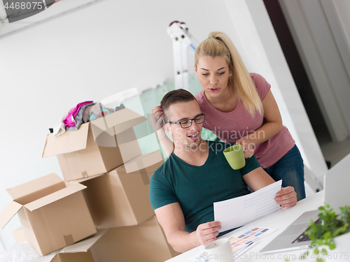 Image of Young couple moving in a new home