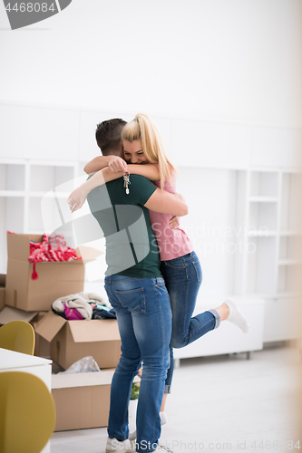 Image of happy Young couple moving in new house