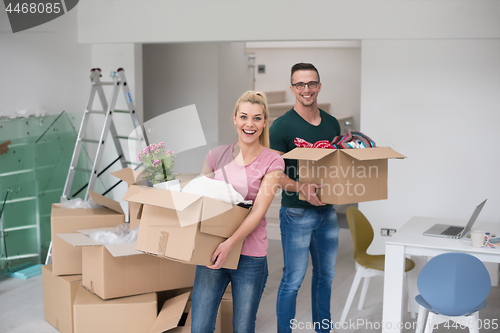 Image of young couple moving into a new home