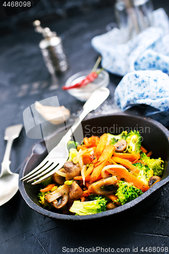 Image of fried mushrooms with vegetables