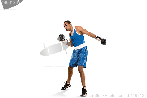 Image of Sporty man during boxing exercise. Photo of boxer on white background