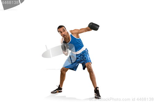 Image of Sporty man during boxing exercise. Photo of boxer on white background