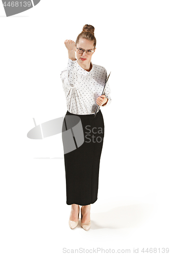 Image of Full length portrait of angry female teacher holding a folder isolated against white background