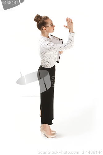 Image of Full length portrait of a female teacher holding a folder isolated against white background