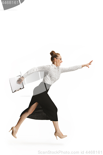 Image of Full length portrait of a smiling female teacher holding a folder isolated against white background