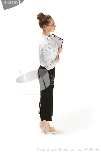 Image of Full length portrait of female teacher holding a folder isolated against white background