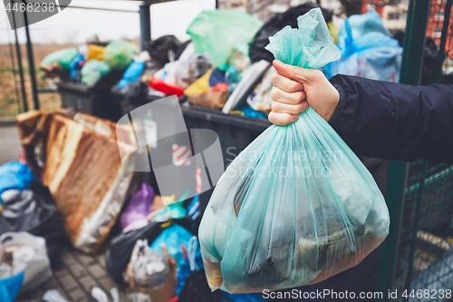 Image of Full trash cans with rubbish bags