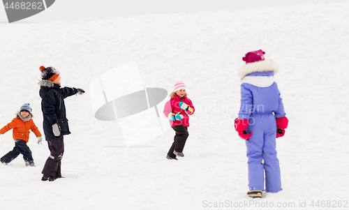 Image of happy little kids playing outdoors in winter