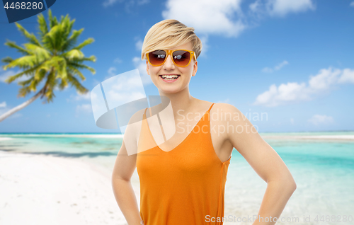 Image of happy smiling teenage girl over beach background