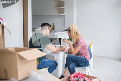 Image of Young couple moving in a new home