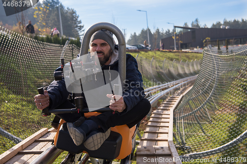 Image of videographer at work on alpine coaster