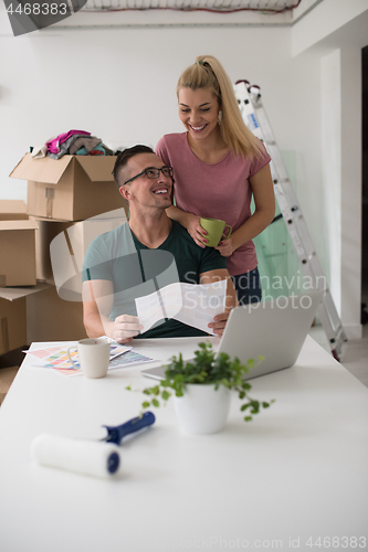 Image of Young couple moving in a new home