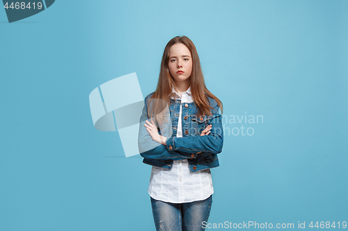 Image of Young serious thoughtful teen girl. Doubt concept.