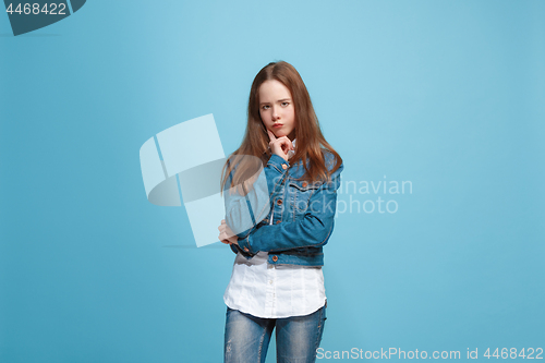 Image of Young serious thoughtful teen girl. Doubt concept.