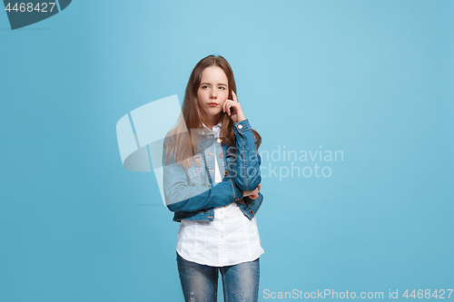 Image of Young serious thoughtful teen girl. Doubt concept.