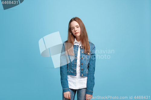 Image of Young serious thoughtful teen girl. Doubt concept.