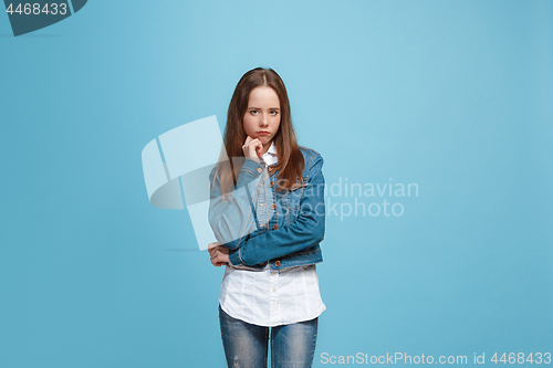 Image of Young serious thoughtful teen girl. Doubt concept.