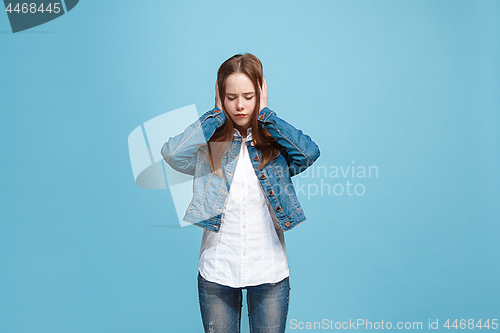 Image of Beautiful woman in stress isolated on blue