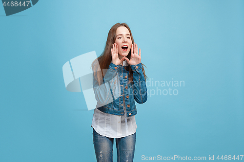 Image of Isolated on pink young casual teen girl shouting at studio