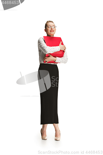 Image of Full length portrait of a smiling female teacher holding a laptop isolated against white background