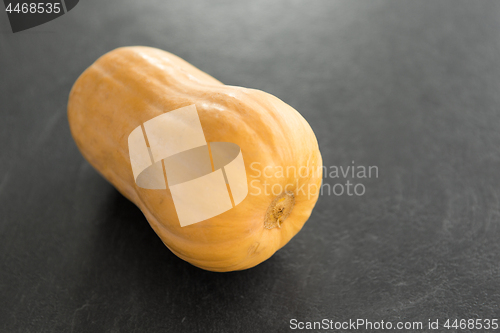 Image of ripe pumpkin on stone background