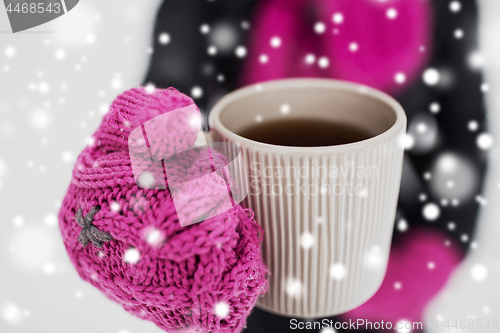 Image of close up of woman with tea mug outdoors in winter