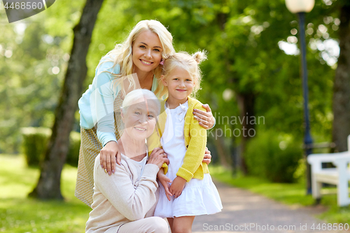 Image of happy mother, daughter and grandmother at park