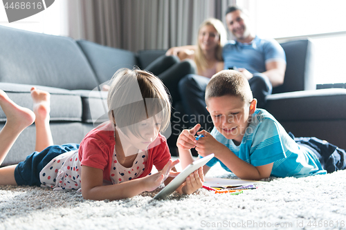 Image of young couple spending time with kids