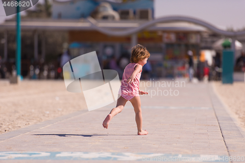 Image of little cute girl at beach