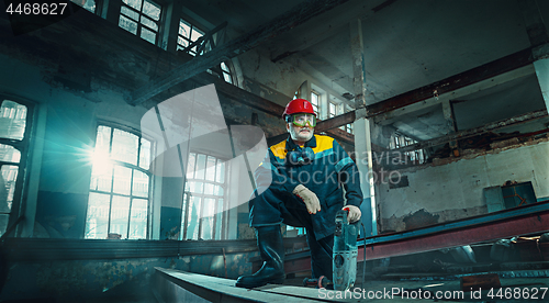 Image of Portrait senior welder worker on manufacture workshop background