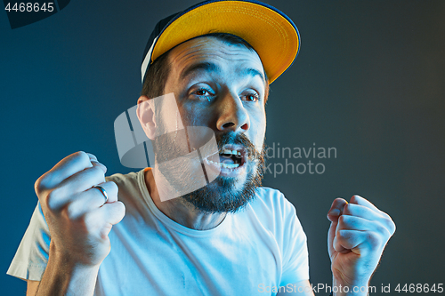 Image of Sports, emotions and fan people concept - sad man watching sports on tv and supporting team at home